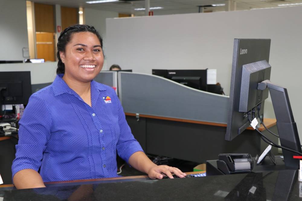 staff member behind service desk